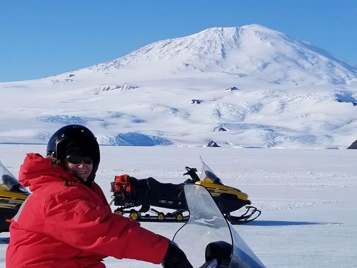 Denise Hardoy riding her Snowmobile to Cape Evans