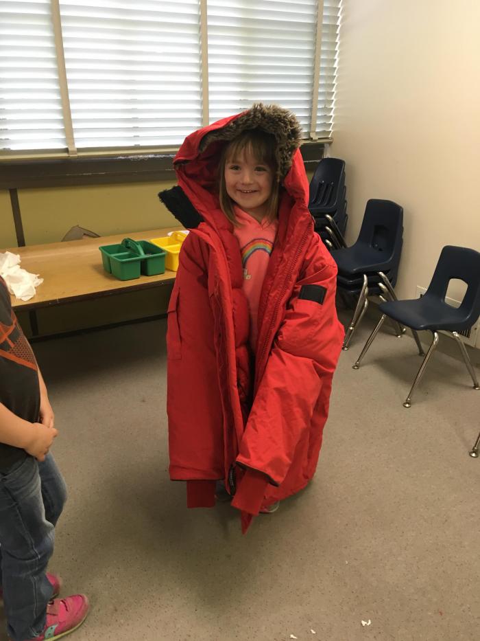 A child in a large red parka
