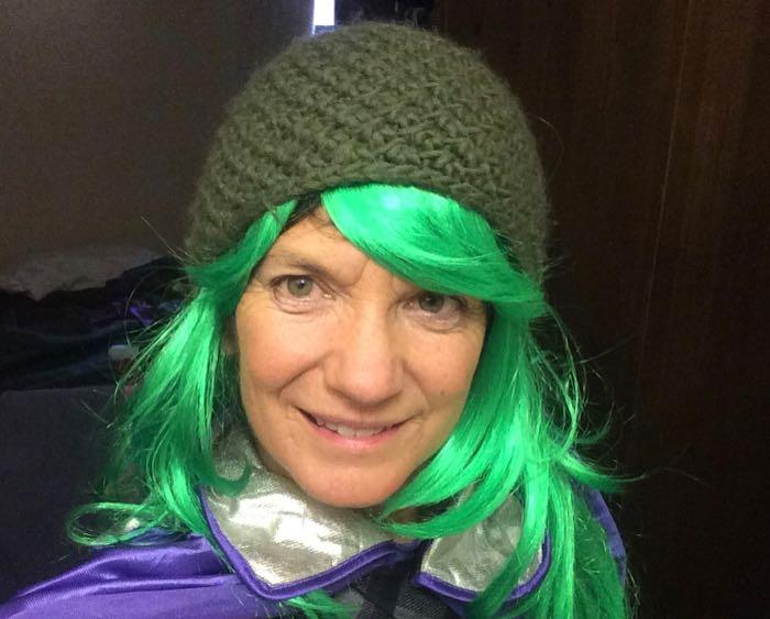 Amy Osborne with a green wig and green hat