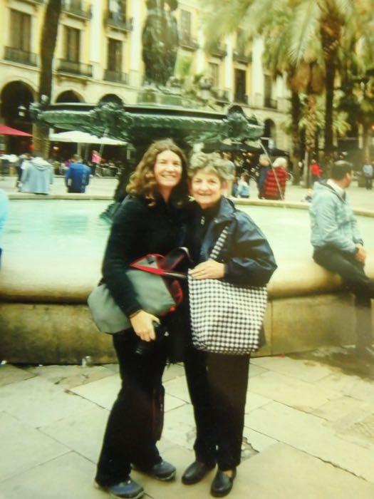 Two women in front of a fountain in Italy.