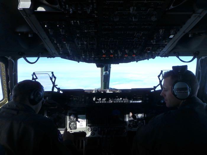 A view from the cockpit of a C-17 airplane