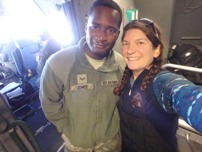 Airman Cedric Jones and Amy Osborne in the cockpit of a C-17