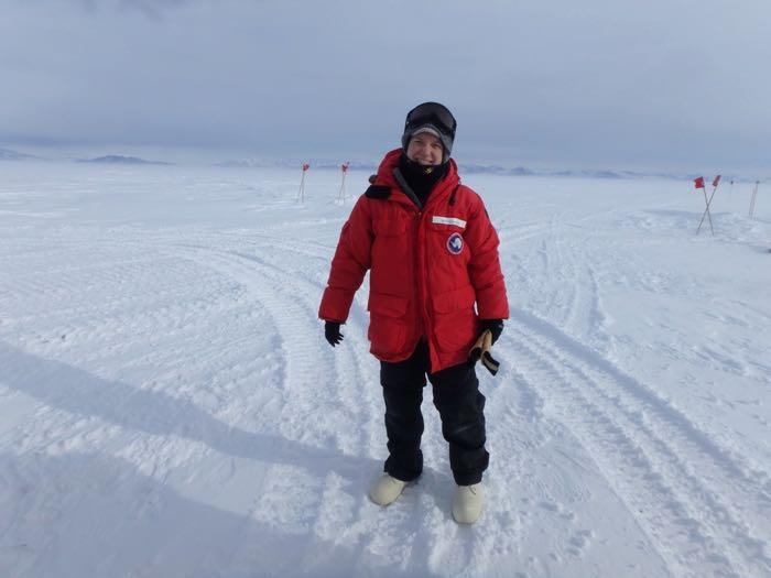 Amy Osborne standing on the sea ice in Antarctica