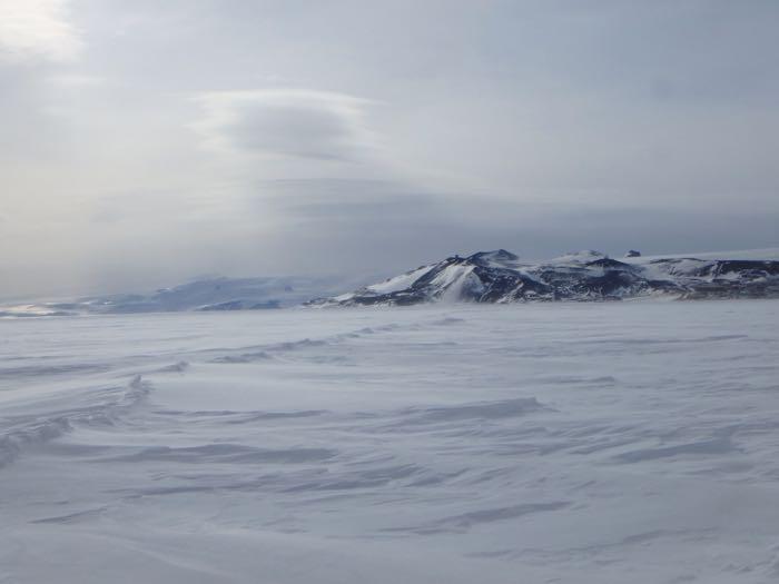 A view of the land from across the sea ice in Antarctica.