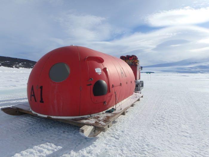 Red dome shaped dive hut that is less insulated, lighter, and easier to transport.