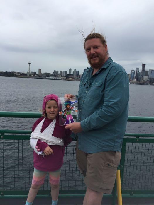 Two people with a drawing on the ferry to Seattle