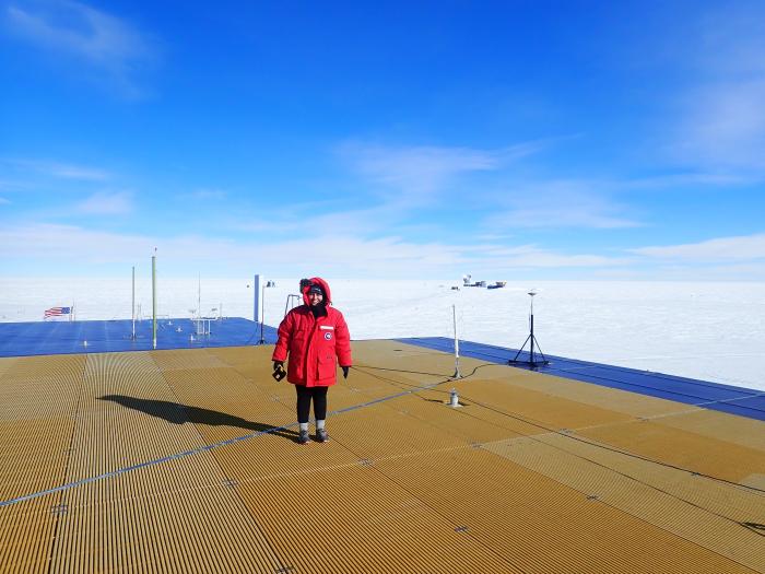 On the roof with IceCube Lab and the South Pole Telescope in the background