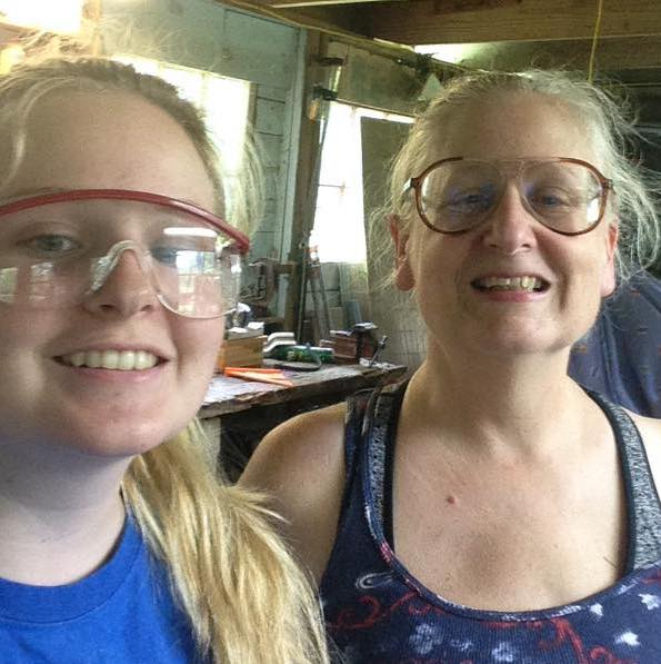 Image shows Liza and her Mom wearing glasses and smiling at the camera.