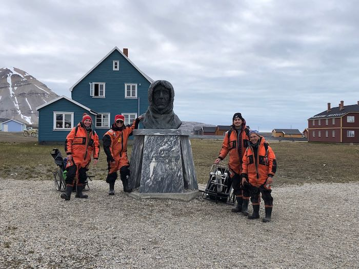 posing in front of Amundsen statue