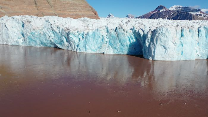 sediment-laden water in front of the glacier