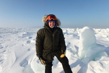 Sarah R Johnson on the Arctic sea ice off the coast of Utqiagvik, Alaska. Photo by Ben Cohen. 