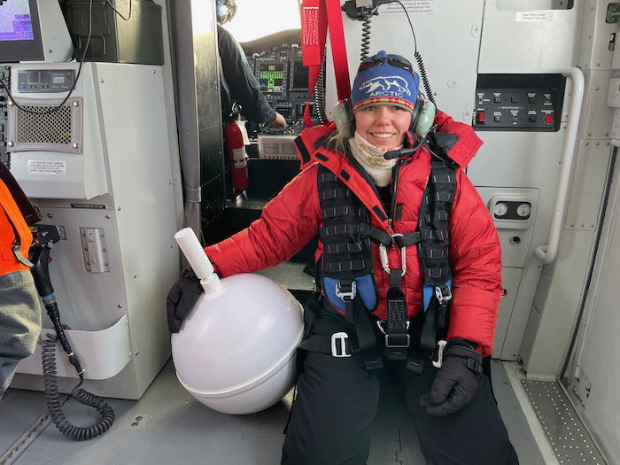 Sarah R Johnson ready to deploy an ice ball buoy on the sea ice along a 100 mile transect line north of Point Barrow. Photo by Ignatius Rigor. 