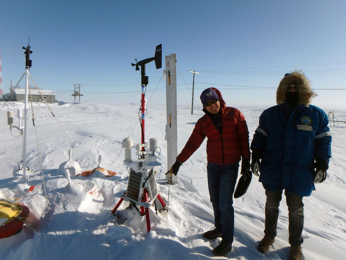 Ignatius Rigor and Ben Cohen at the International Arctic Buoy Programme test site located between the Department of Energy Atmospheric Radiation Measurement site and the NOAA Barrow Atmospheric Baseline Observatory in Utqiaġvik, Alaska. Photo by Sarah R. Johnson. 