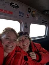 Denise and Amy on the C-130 heading home