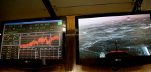 Screens showing weather conditions and the view off the bow of the R/V Nathaniel B. Palmer icebreaker