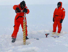 Kyle Dilliplaine drilling ice core at North Pole
