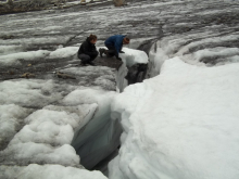 Kayla and Dion peering into the glacial abyss