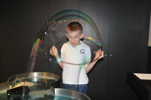 Garrett makes a big bubble around himself in the Anchorage Museum