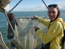 I help to bring in the trawl net.
