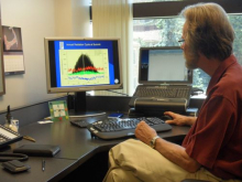 Professor Steffen at computer showing radiation data.