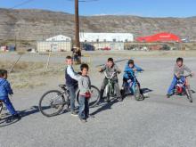 Local kids riding bikes and playing.