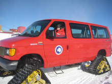 The van has snow treads instead of wheels!