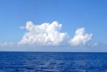 Clouds over the beautiful blue sea near where the Caribbean meets the Atlantic Ocean. 