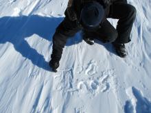 South Pole written in snow to show where it has moved to.