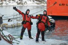 Julie Scram and Maggie Amsler returning from a dive at Palmer Station
