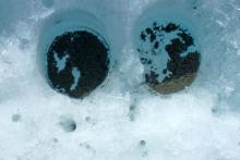 Ice Holes Caused by Dust