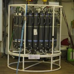 Oceanographic research instrument. This CTD measures conductivity (which tells us how salty the water is), temperature, and density. It also contains sampling bottles which are closed at different depths, capturing water. The water is analyzed for things like dissolved oxygen and nutrients like nitrogen. It also can be filtered to look more closely at phytoplankton present and chlorophyll concentrations. It is an important tool for studying phytoplankton and environmental factors in the ocean. (Photo courte