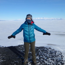 Amy Osborne in front of sea ice.