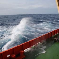 Waves crash on the starboard aft deck of the Palmer