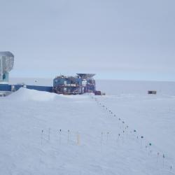 The South Pole Telescope on the left