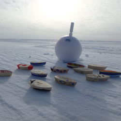 Ice Ball buoy with wooden boats