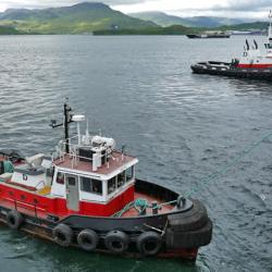 Tugboats Pulling Healy Away from Dock
