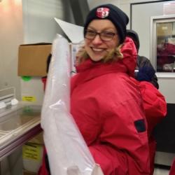 PolarTREC teacher, Lauren Adamo, holding an ice core.