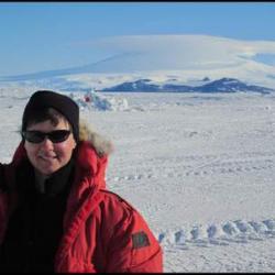 Lynette Barna with Mt. Erebus in the background.
