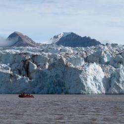 boat in front of glacier