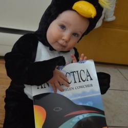 Baby dressed up as penguin.